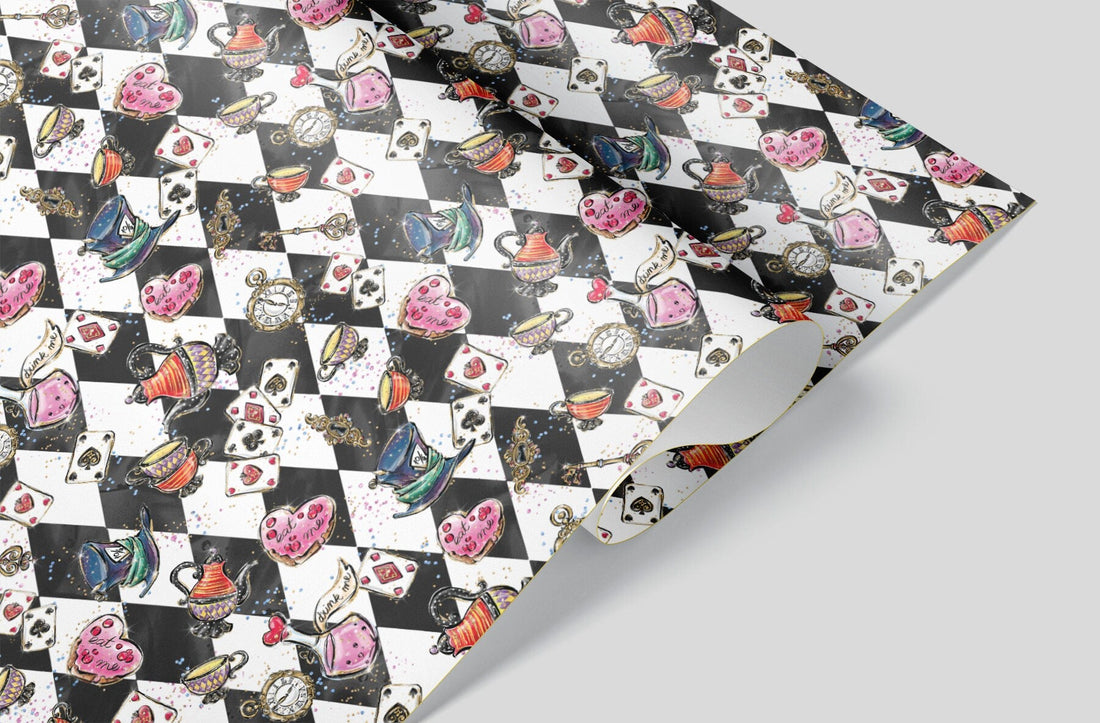 A close up of Black and White Checkerboard wrapping paper with Alice and Wonderland icons, Such as a "drink me" potion and the Mad Hatter's Hat