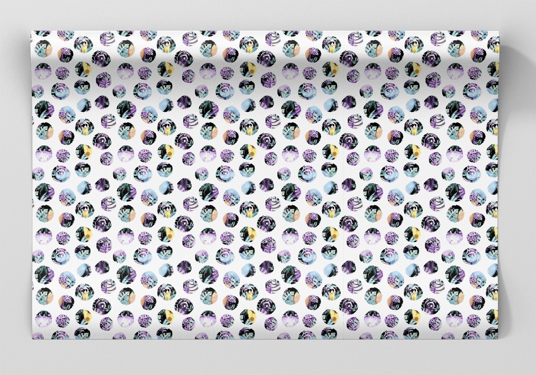 a sheet of wrapping paper with a white background and jungle floral polka dots 