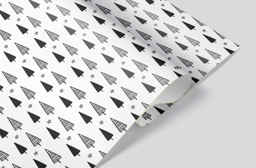 White wrapping paper with hand sketched christmas trees and stars