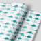 white wrapping paper with blue stegosaurus dinosaurs