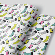 Christmas Wrapping paper with bright colored socks or bright colored christmas stockings