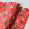 Red wrapping paper with Holly, Mistletoe, Pine Cones and branches