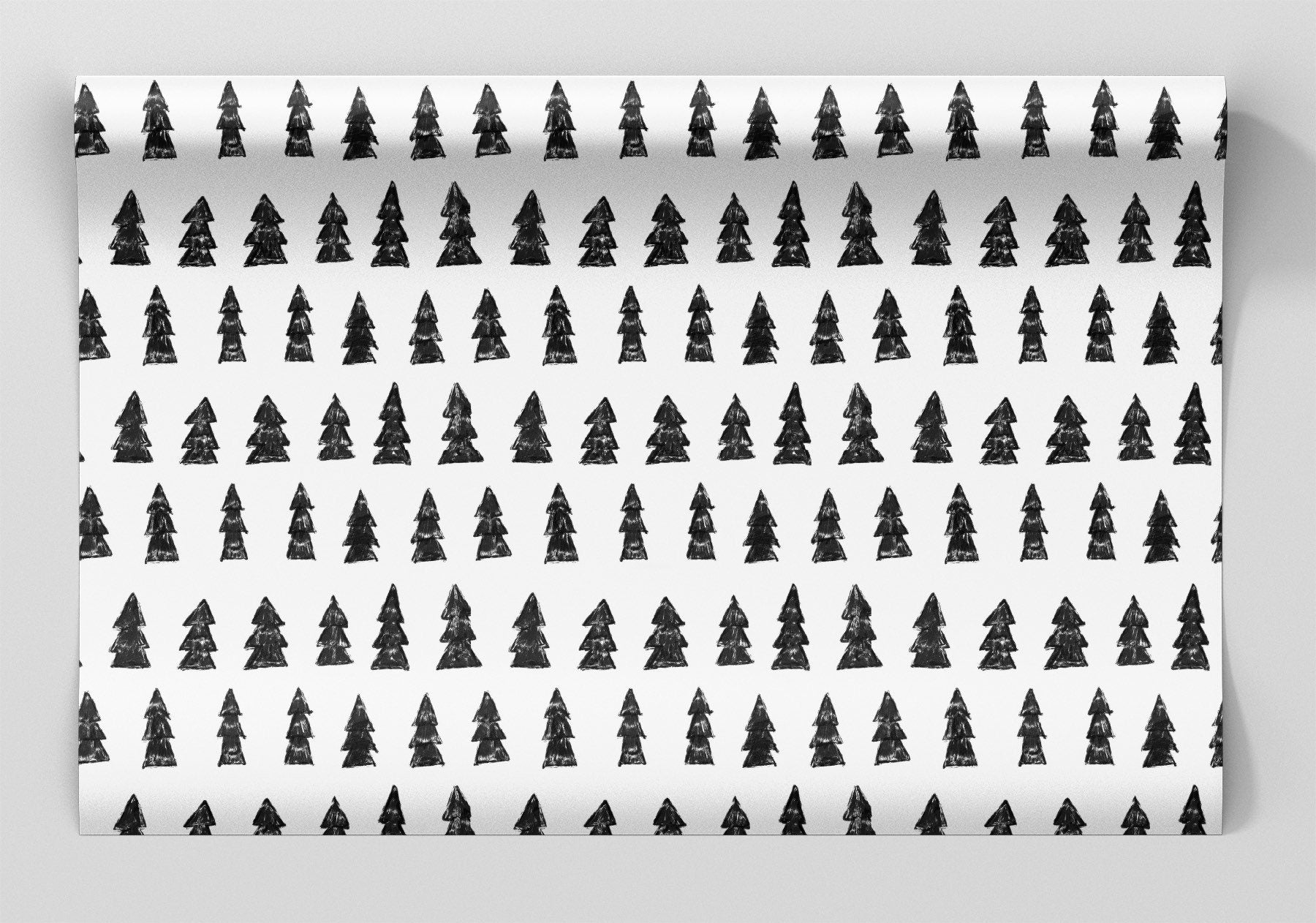 Full Sheet of white wrapping paper with charcoal drawn pine trees for Christmas