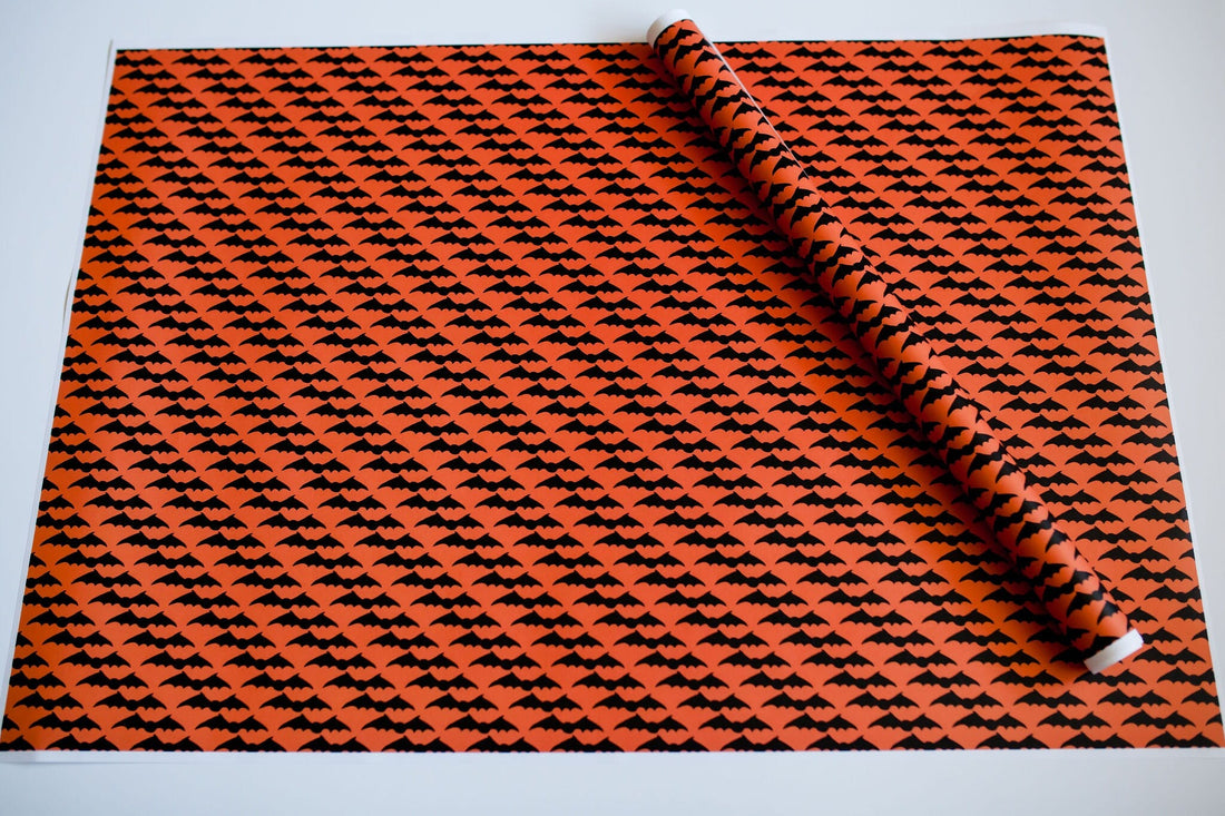 Orange wrapping paper with black bats