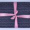 Navy wrapping paper with pink christmas lights